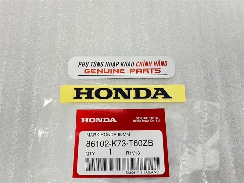 Tem Honda yếm trắng Wave 125i 86102-K73-T60ZB